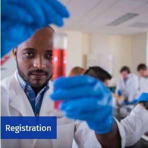 Student in a lab. Access course registration information.