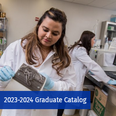 View of students in food science lab. Image indicates to open 2023-2024 Graduate Catalog.