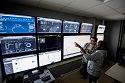 Students looking at a computer monitor in e-Trading lab.