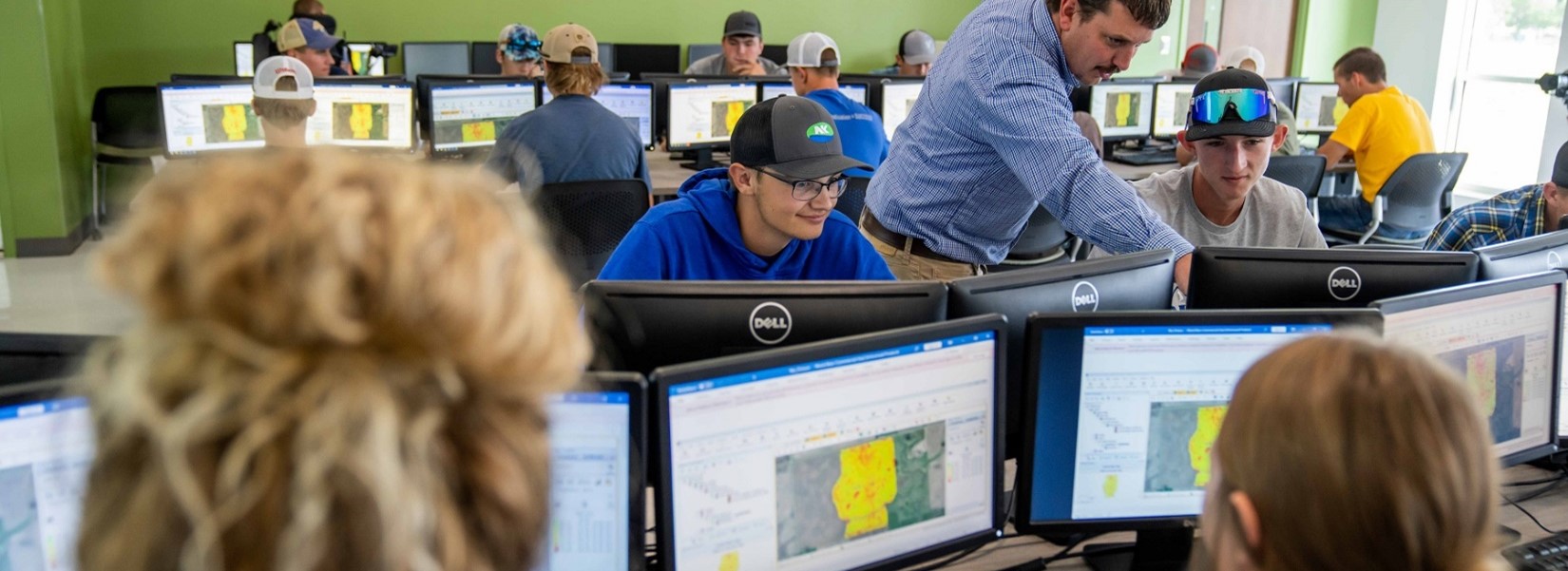 Students and instructor in a computer lab.