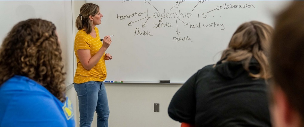 Students listening to their instructor.