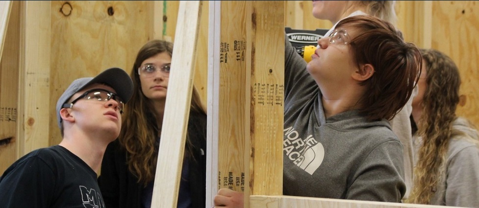 Students working on a construction project.