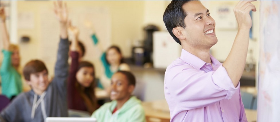 Teacher in a class with young students.