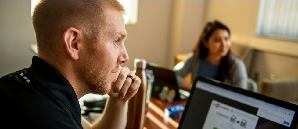 Students sitting by their computers.