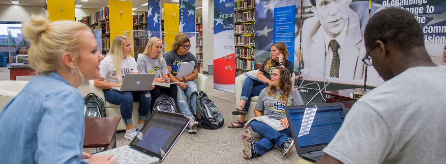 Students studying at the HM Briggs library.