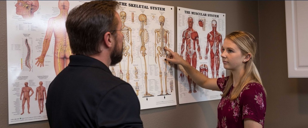 Student working with a chiropractor.