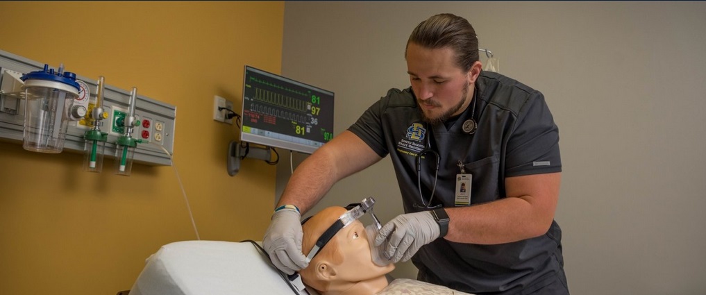 Respiratory care student working in a simulation lab.
