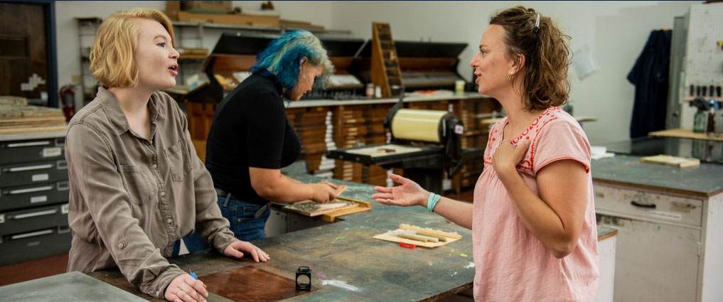 Students and instructor in art studio.