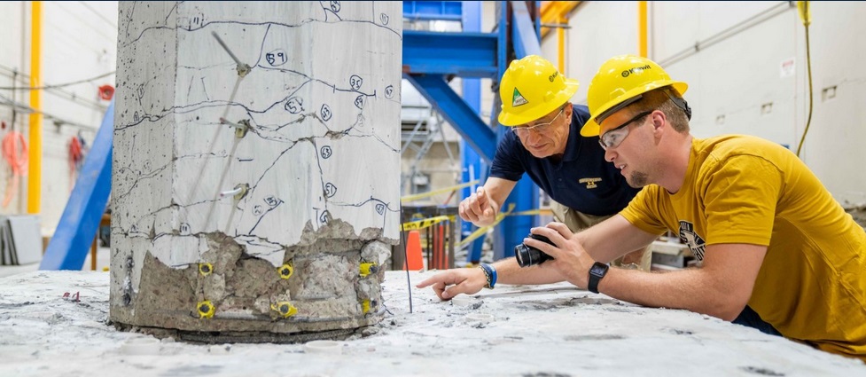 View of a professor and student working in the structural civil engineering lab.