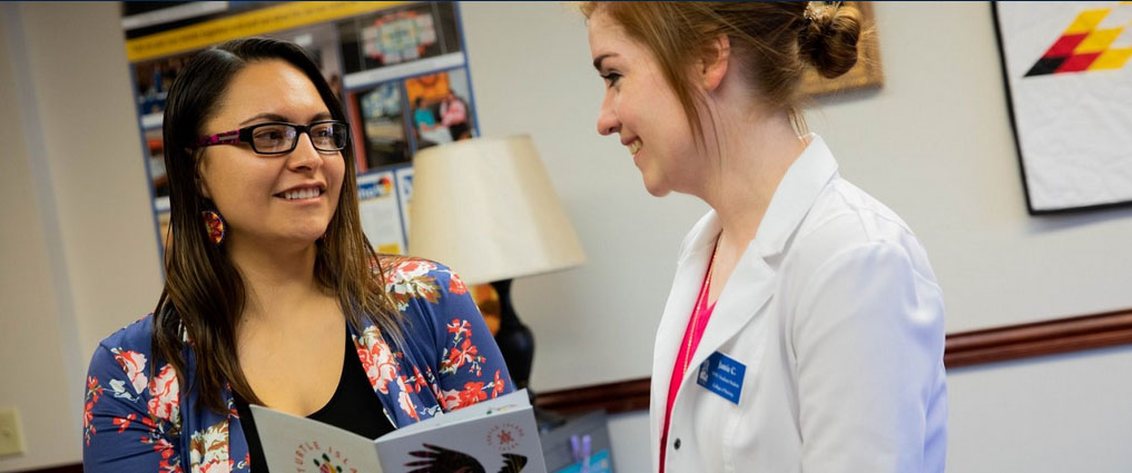 Student talking with an advisor.