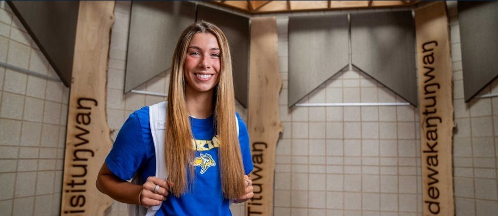 Student standing in the American Indian Student Center.