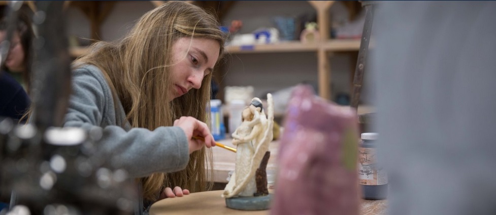 Student working in a ceramics lab.