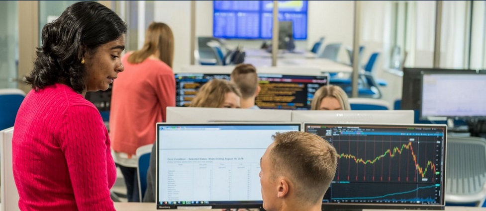 Students and instructor in a finance lab.