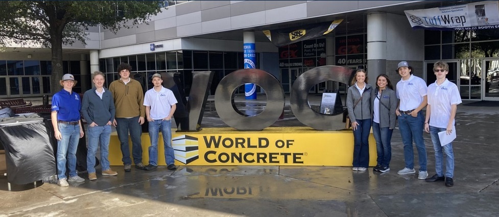 Students standing together for a photo at the World of Concrete convention.