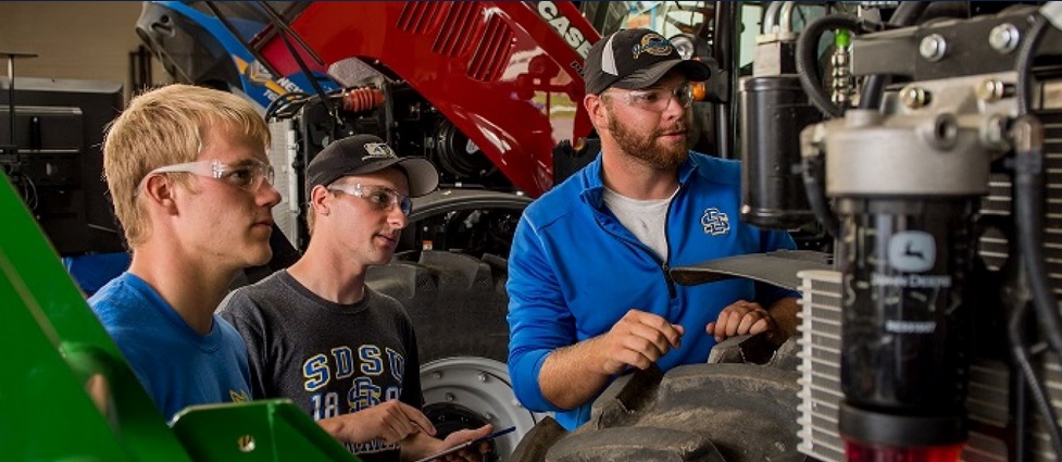 Students looking at machinery.