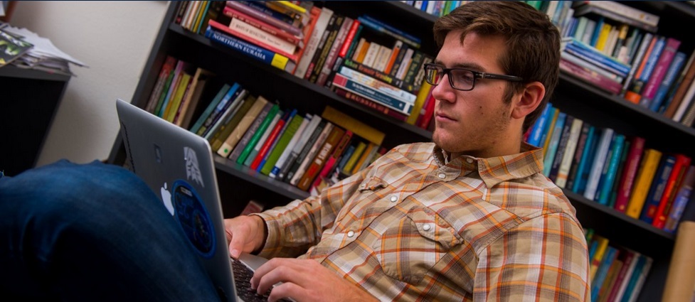 Student looking at a laptop.