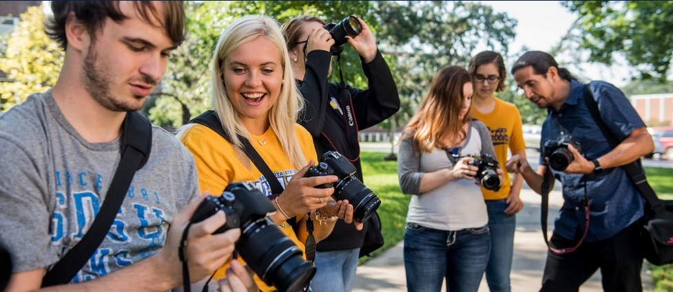 Students and instructor working with cameras.