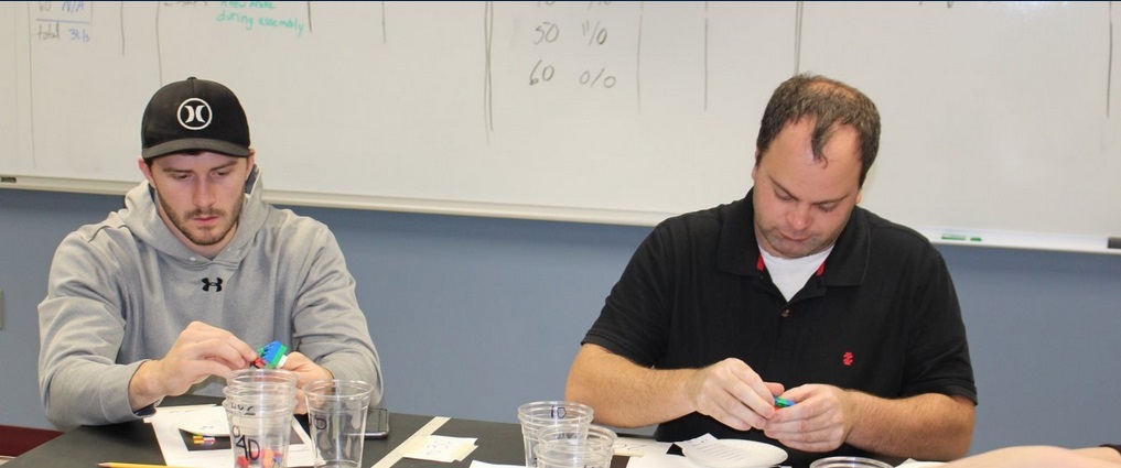 Two students in a classroom.