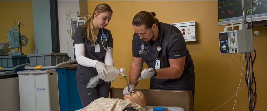 Respiratory care students working in a simulation lab.