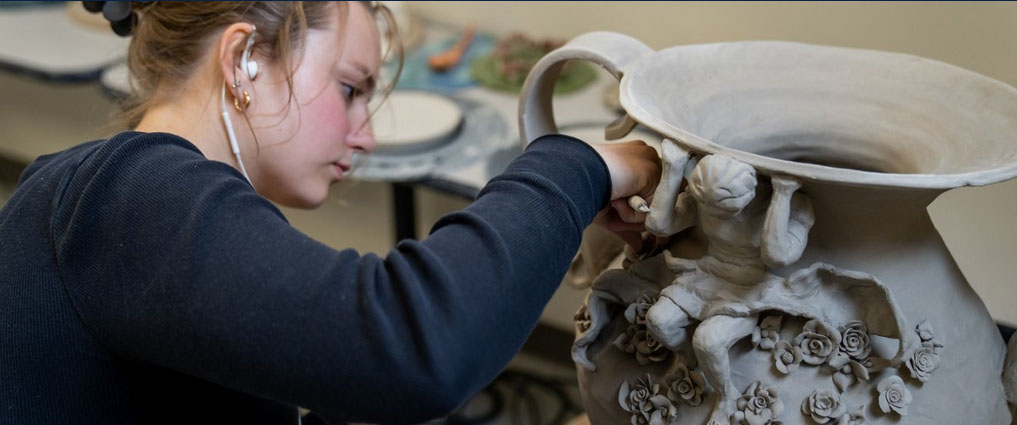 Student in ceramics lab.