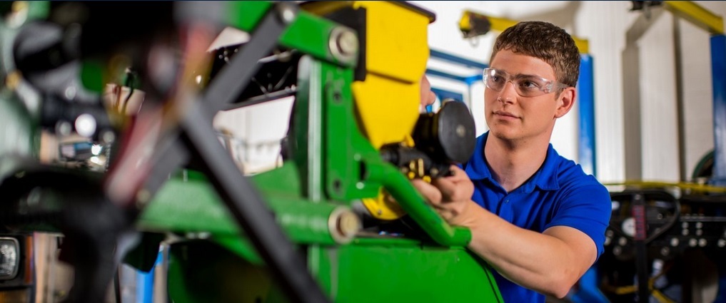 Student working on a piece of equipment.