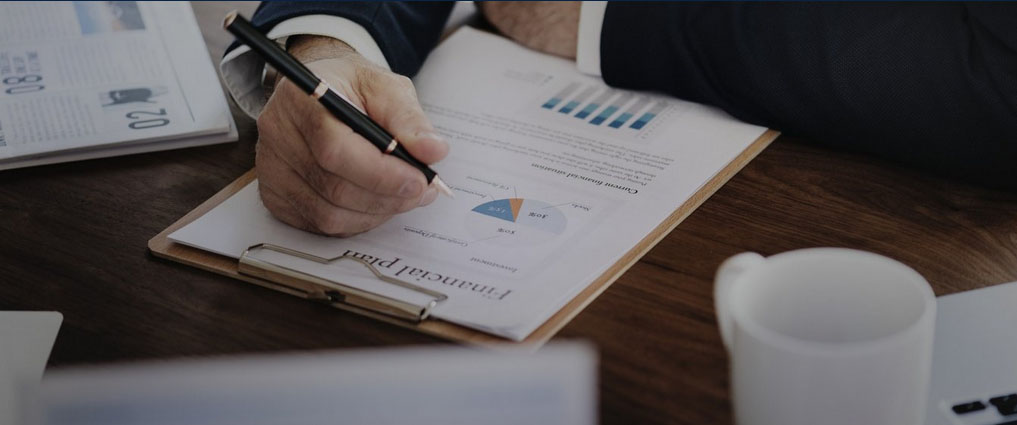 Person looking at data on a piece of paper.