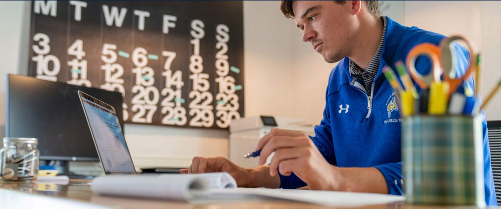 Student studying at a desk.