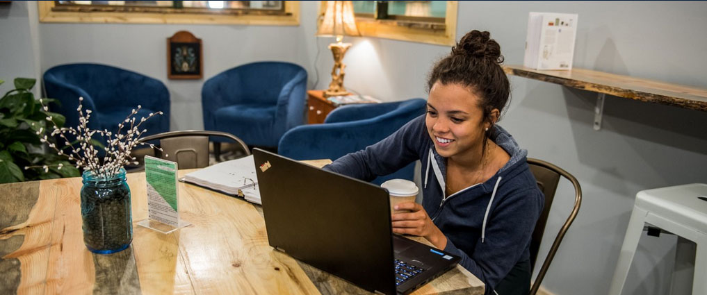 View of a student sitting at a table studying.