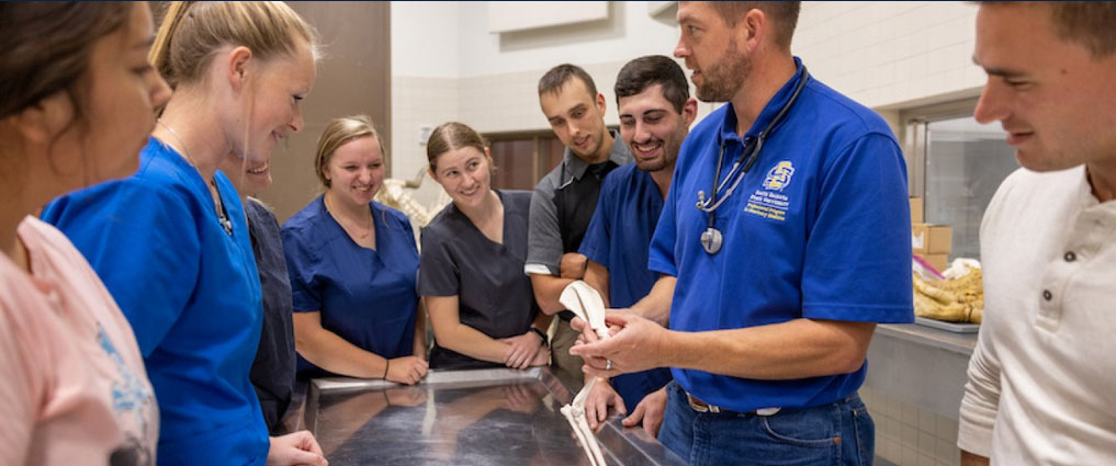 Instructor showing bone to students