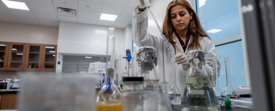 Student working on a piece of equipment.
