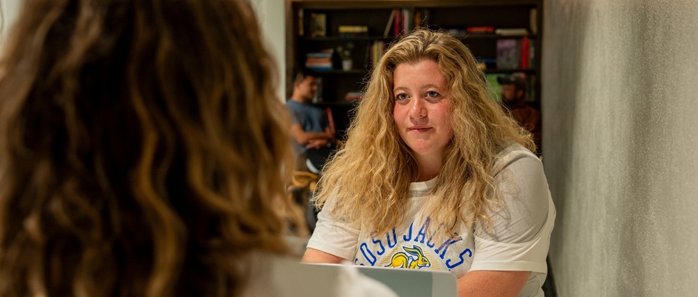 Two students having a conversation.