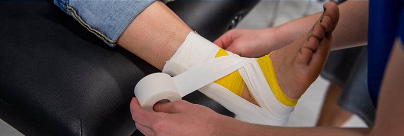 View of an ankle being wrapped.