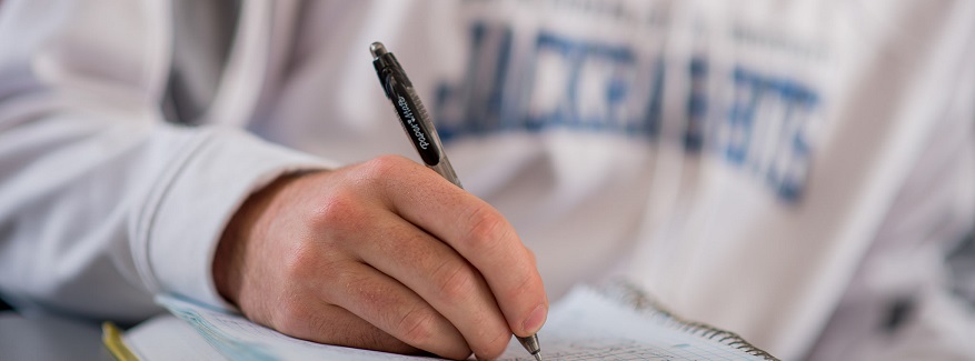 View of a student writing.