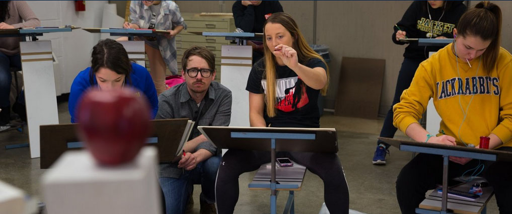 Students and instructor in drawing class.