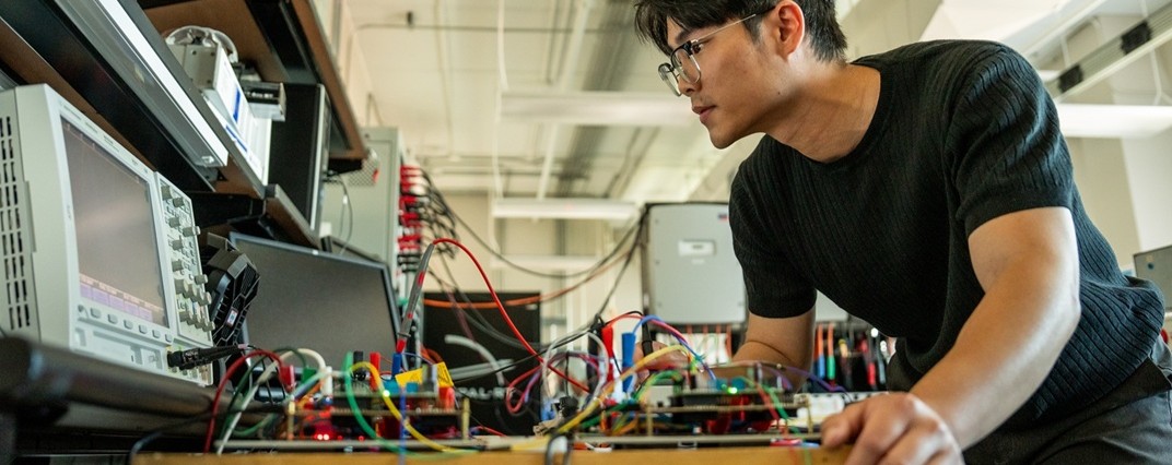 Student working in an electrical engineering lab.