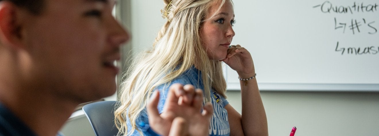 Student sitting in a classroom.